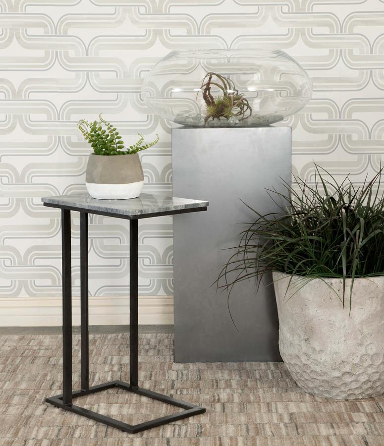 Keep a drink or snack close by as you watch a favorite TV series. This contemporary accent table offers a spacious surface area for mugs, tablets and more with its classically designed marble top. The smooth and polished marble top rests on an iron cantil