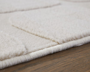  furry floor covering? The subtly stunning abstract design and textured faux fur of this rug create a trendy look thatâ€™s sure to elevate any modern home. The best part? It-'s super easy to cleanâ€”simply drop it in the washing m