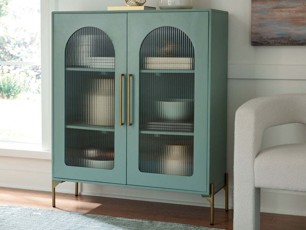 Clearly a stunning statement piece for lovers of contemporary design, this sleek accent cabinet wows on many levels. Magnificent arched fluted glass door panels and goldtone metal hardware exude serious modern flair. And how about that fresh green finish?