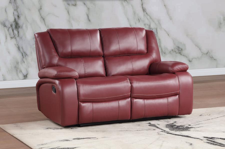 Make seating a primary function in a living space with this elegant two-seater reclining loveseat. Kick back in comfort to watch sports, movies, or to read, enjoying a smooth red leatherette upholstered loveseat with plump cushioning in structured backs a