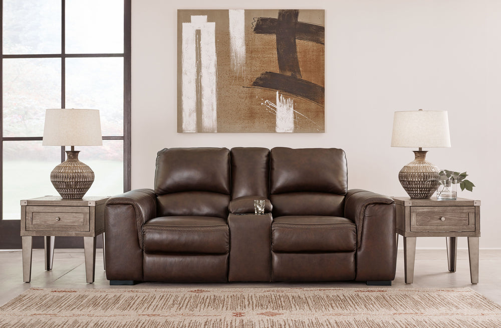 Impressive in scale while keeping an air of refinement, this power reclining loveseat stuns with a combination of soft, supple leather and perfectly matched faux leather upholstery in walnut. Sink into the seating area and cater to your comfort with one-t