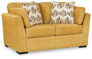 You want your home to reflect your modern, trendy eye for design. This loveseat is here to help. Bold, bright and beautiful, it adds a fashion-forward pop of color to your living room. Velvet-like upholstery and matching bolster pillows keep comfort at to