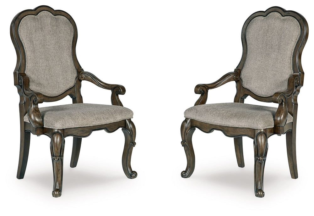 From the ornamental appliques to the large scale, this dining armchair makes a bold statement. With shapely legs and a plush cushioned seat and back, the opulent piece wows with stunning style. The look is timeless. The feel? Right at home.<br><br><b>Addi
