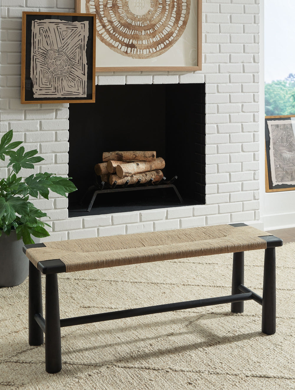 Understated style done beautifully well. The black wood frame and tapered post legs of this accent bench are a striking contrast with its handwoven natural jute upholstery. Combining a contemporary aesthetic with a mid-century vibe, it-'s ideal for a livi