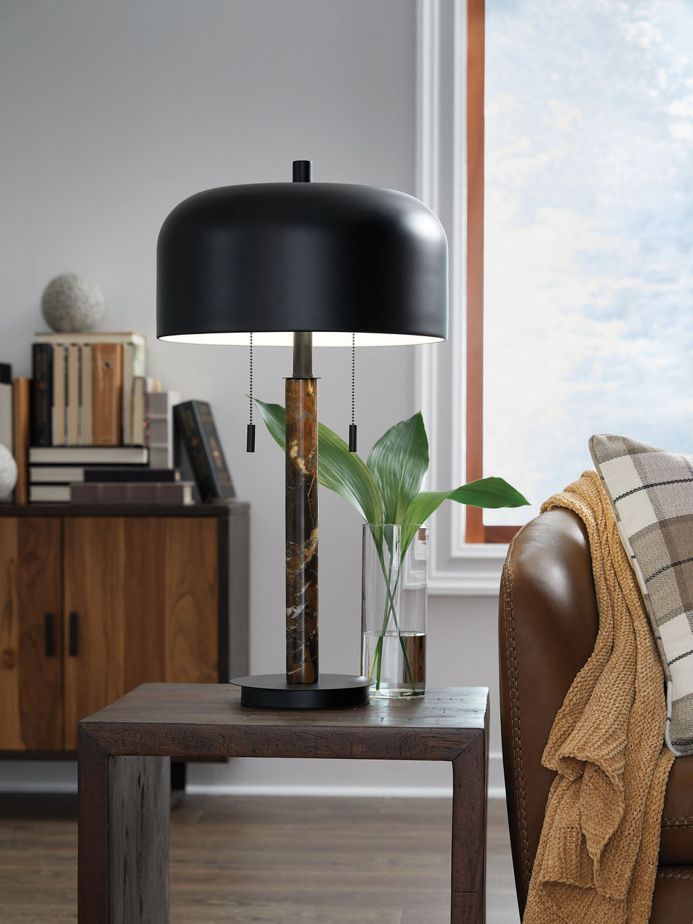 A luxurious addition to any living room, this table lamp is an instant classic. Crafted with dark brown marble and black metal, and topped with a metal shade, it brings a moody, masculine feel to contemporary style.<br><br><b>Additional Dimensions</b><br>