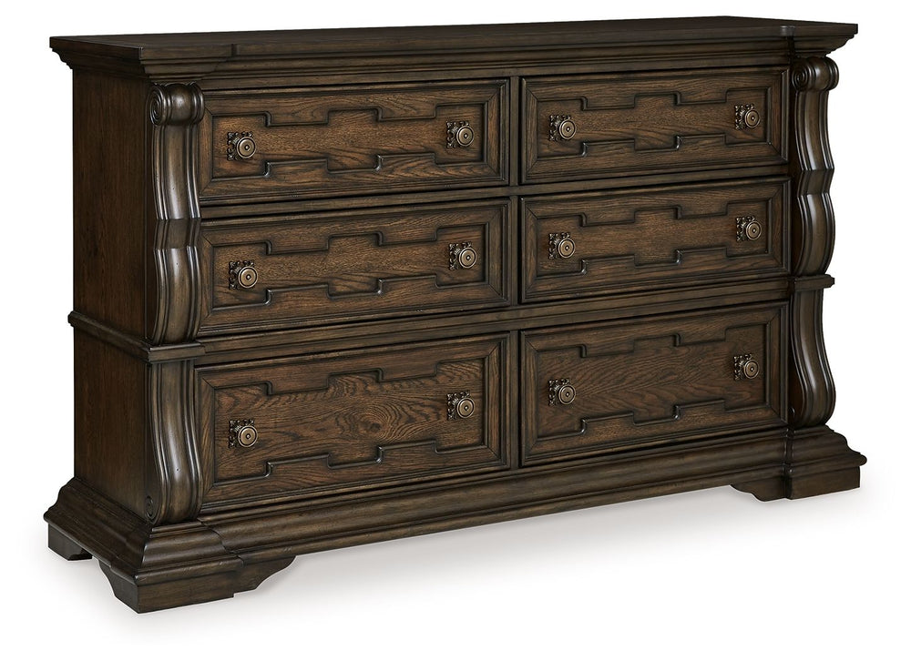 From its ornamental appliques to its large scale, this dresser makes a bold statement. Spacious drawers store your clothes, jewelry and more in stunning style. The look is timeless. The feel? Right at home.<br><br><b>Additional Dimensions</b><br><ul><li>T