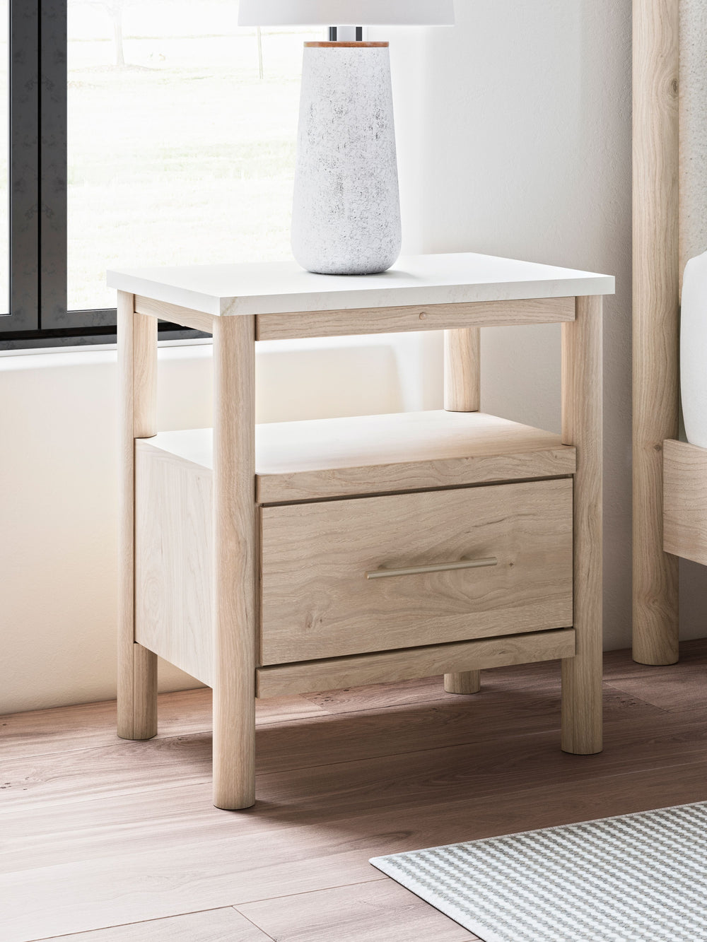Transform your bedroom with this nightstand. With its clean lines and replicated marble top, it exudes a minimal and sophisticated boho style. Built-in lighting and charging capabilities add simplicity and ease to your everyday tasks. Tailor your space an