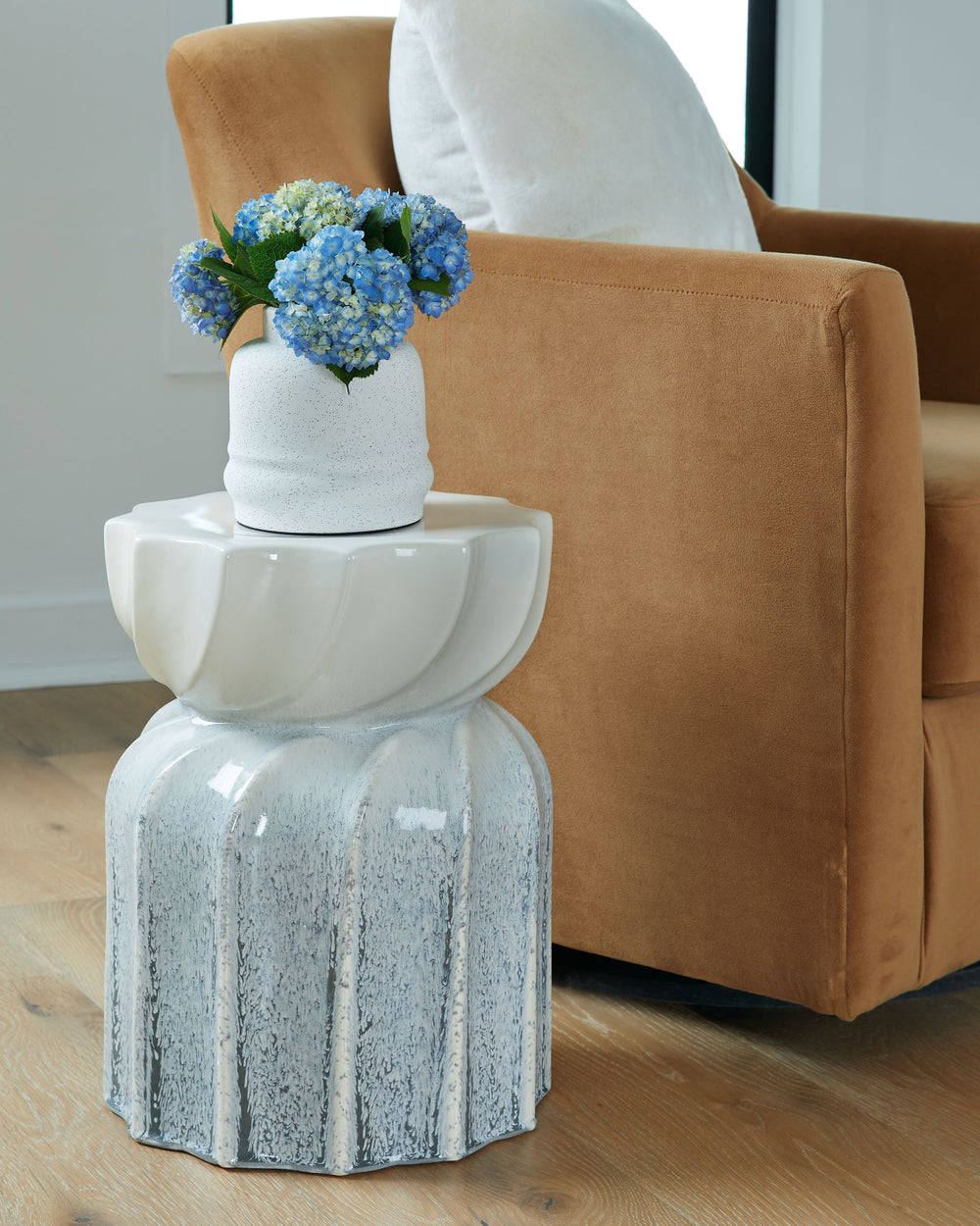 Show off your green thumb, or an eye for delightful decor, with the help of this stool. Its taupe and gray reactive glaze provides a neutral base that suits a variety of spaces. Use it indoors or outdoors to display plant life or assorted accents of your 
