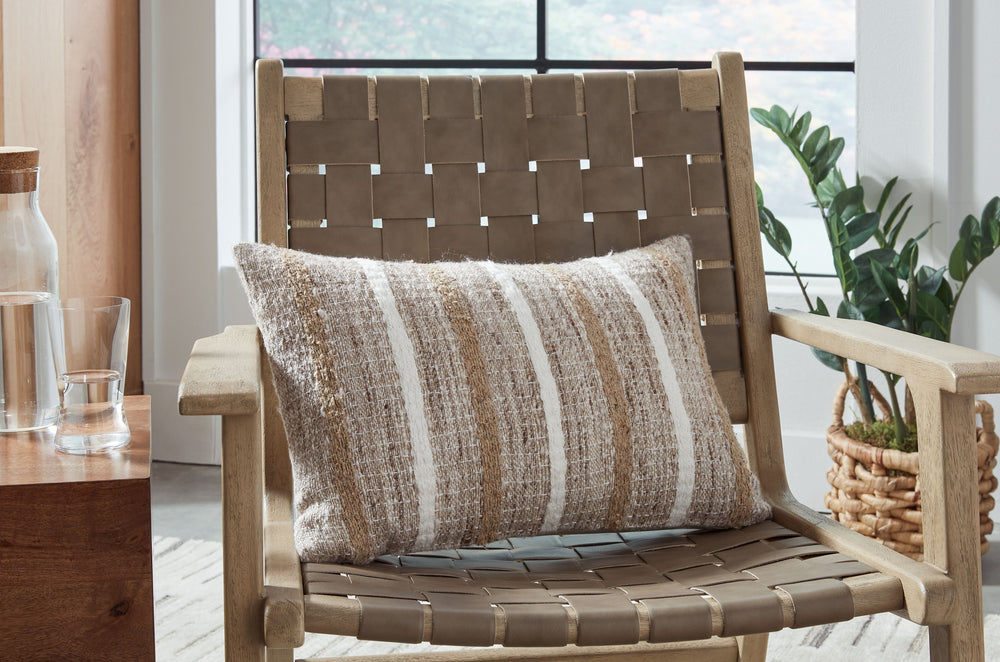 This lumbar accent pillow lends casual style and personality to any room. Its neutral striped design is an easy way to refresh your furniture for a new look and feel. Therapeutic as well as appealing, this pillow provides back support no matter where you-