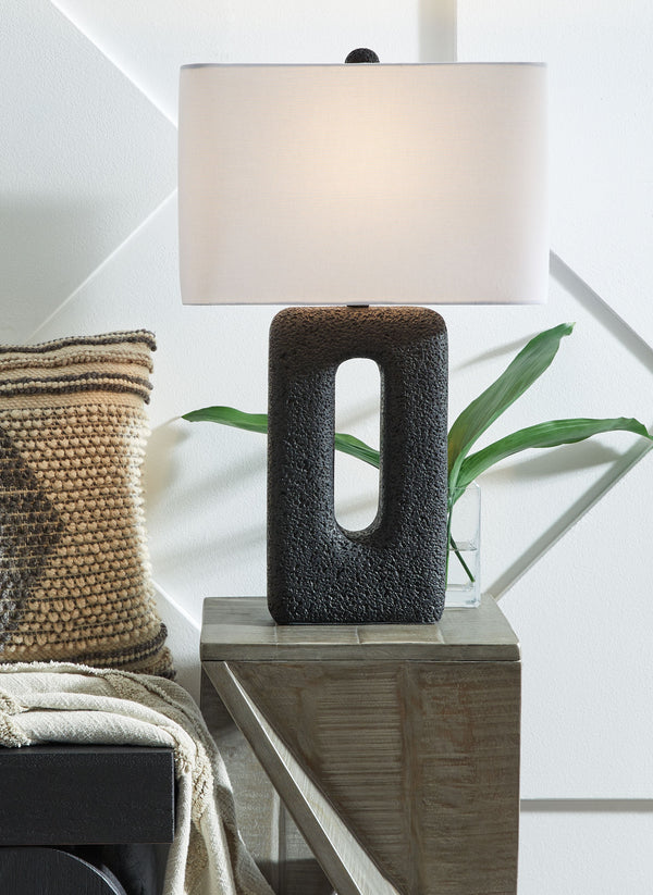  modern design. The textured cutout base and sleek rectangular shade elevate them to an art form. Place these accent lamps on a console table for a touch of chic