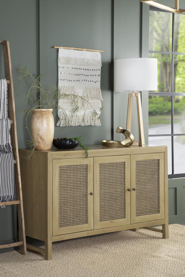 Infuse your space with the organic beauty of this global-inspired accent cabinet, crafted from eco-friendly mango wood in a warm natural finish. The three cabinet doors feature woven cane panels, adding a retro touch while allowing for subtle ventilation.