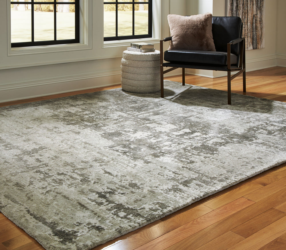 Keep your decor eye-catching from head to toe. Rich with abstract movement, this rug-'s combination of gray and ivory expertly reflects your contemporary color palette. What an artful way to add warmth and comfort underfoot.<br/><br/><b>Product Features</