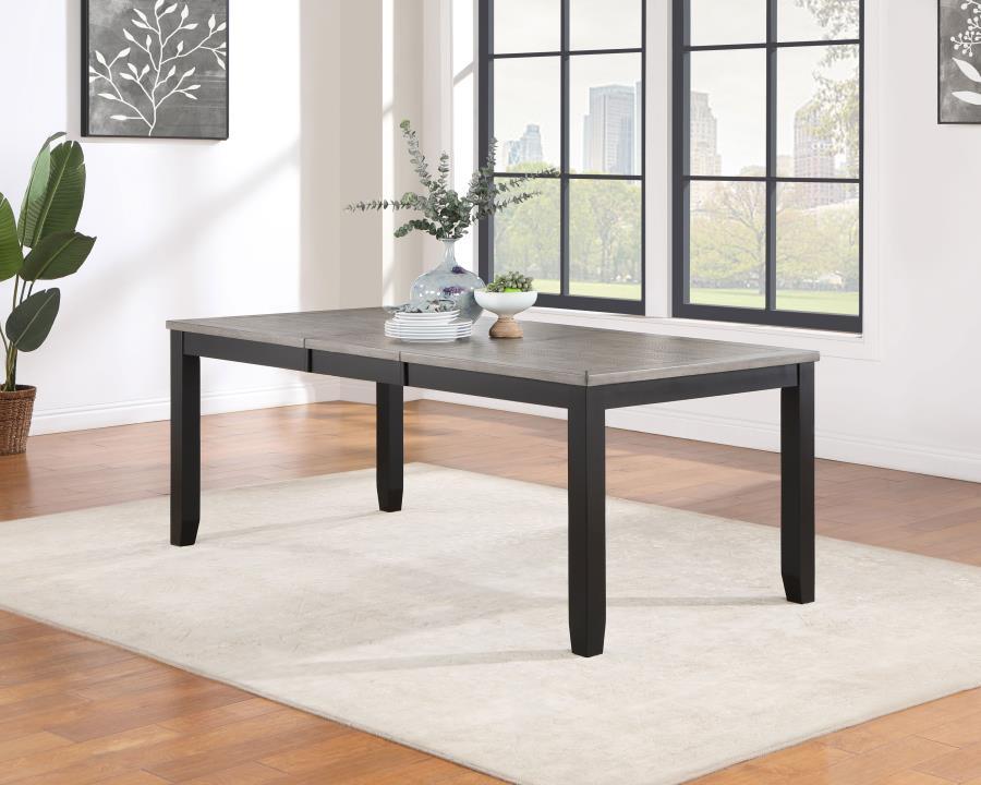 Create a versatile and comfortable dining space with this dining table. With its 60" to 78" extension capability, including an 18" leaf, it provides ample seating and smooth transitions. The wood on metal glide ensures effortless operation. Crafted with a