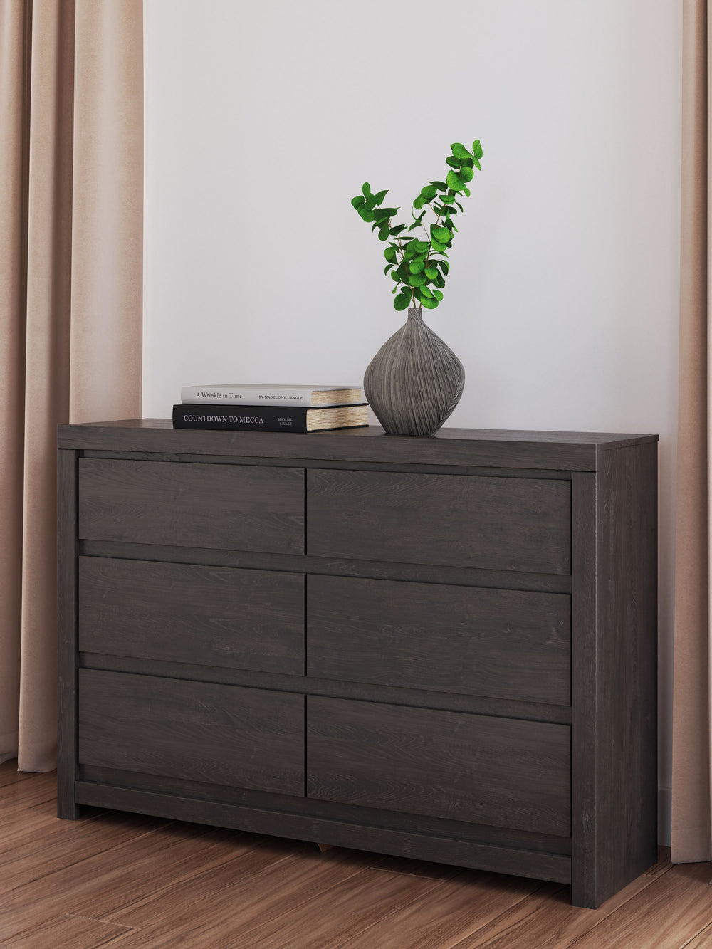 Find serene simplicity in the clean lines and dark neutral tones of this dresser. Itâ€™s a sincere approach to modern elegance, giving you high style at a great value. A sleek hardware-less design creates a fuss-free look. Short on storage? This dresserâ€