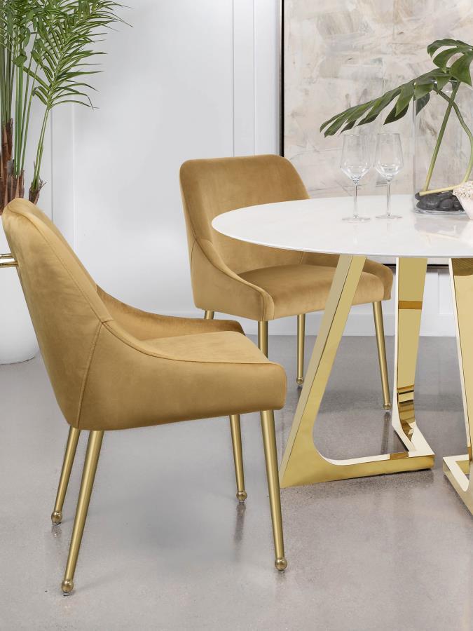 Cradle yourself in the embrace of opulence with this Italian style modern dining side chair, where comfort meets sophistication. Its plated metal legs, tapering into geometric spheres, create a foundation that-'s as sturdy as it is striking. The seat, a h