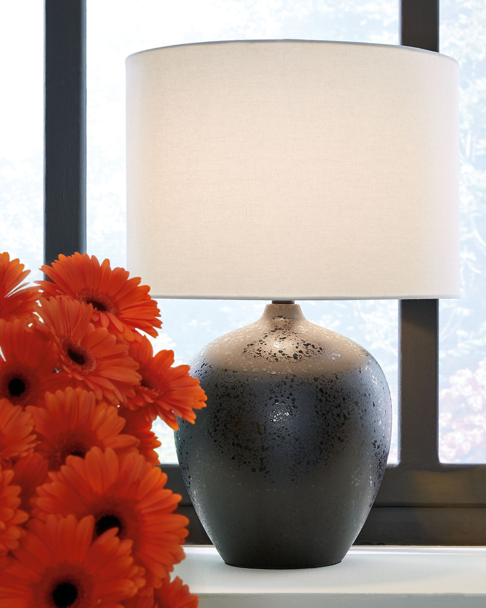 With its gorgeous ceramic base, this table lamp is a sleek, modern way to keep out of the dark. Place it on a desk, side table or dresser to add an extra pop of light to your living space.<br><br><b>Additional Dimensions</b><br><ul><li>Shade: 0-"</li><li>