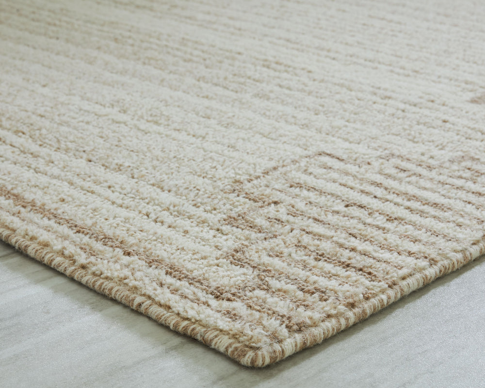Dress up any floor with the tastefully approachable design of this rug. Its distinctive stepped border pattern, rendered in versatile neutrals, creates a subtly eye-catching look that brings modern elegance to any casual space. Crafted from wool with a ge