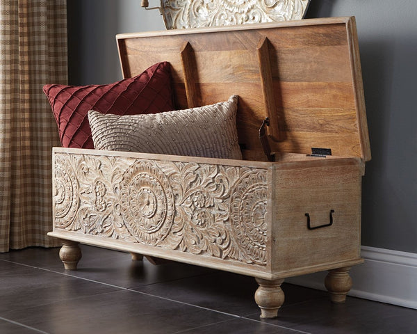  this storage bench stands out from the crowd in an intriguing way. Its grainy wood is beautified with an antique white finish