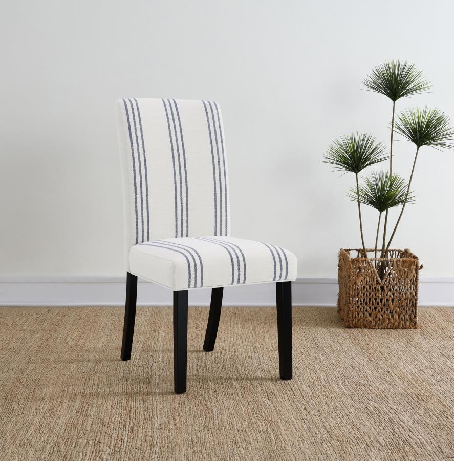 This dining chair blends casual elegance with functional comfort, making it a versatile addition to dining spaces. Upholstered in a linen-like beige fabric with subtle blue stripes, it adds a relaxed yet refined aesthetic. The chair features a padded seat
