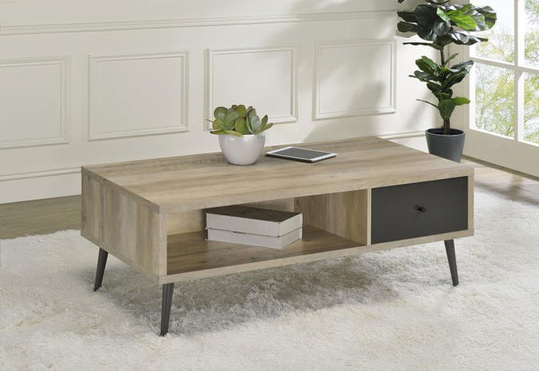  adding a tasteful and practical coffee table. This wood cocktail table fits beautifully in an easy-living family room or living room