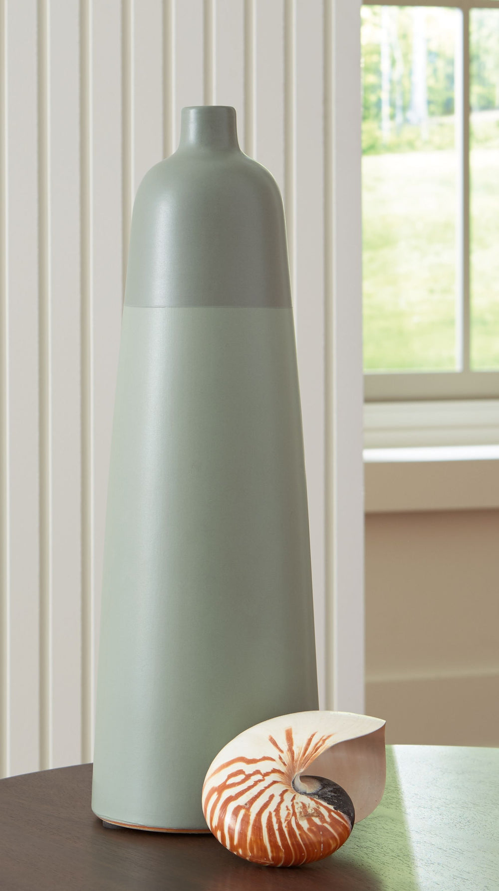 This richly glazed ceramic vase makes a striking centerpiece, either by itself or when filled with dried or faux florals. Its simply beautiful shape and organic green hues complement your naturally superb sense of style.<br/><br/><b>Product Features</b><u