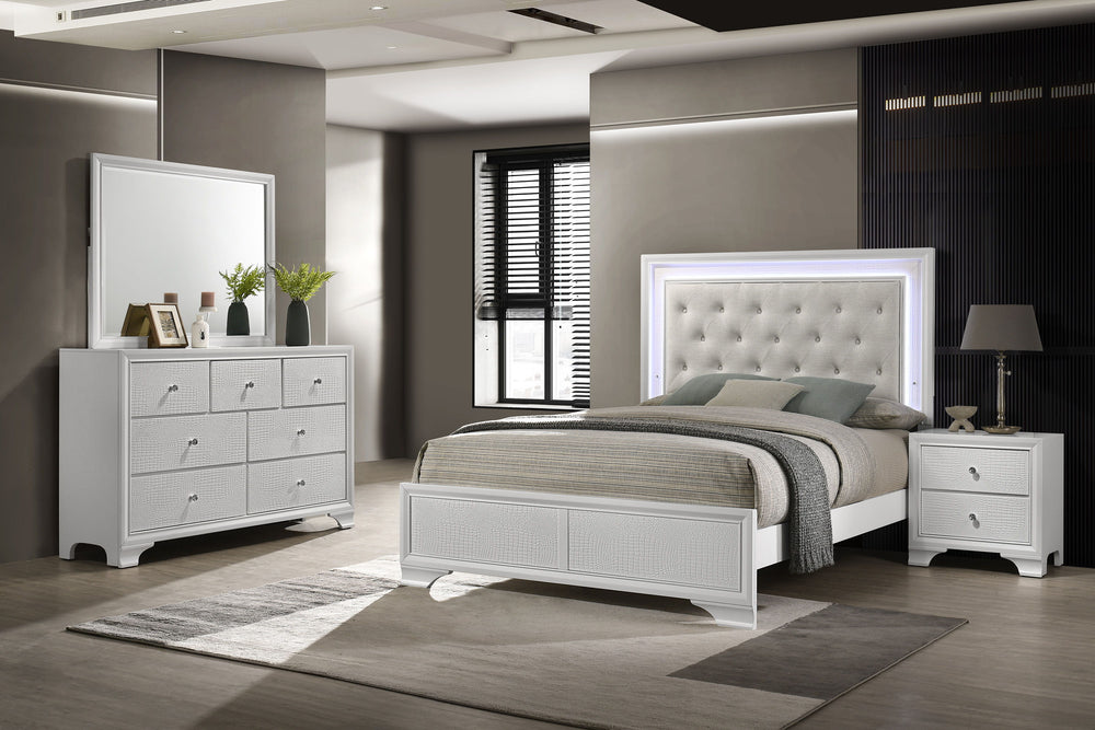 Step into a realm of sophistication and comfort with this stunning bedroom collection. Each piece showcases an exquisite blend of traditional charm and contemporary flair, making a bold statement with its textured surfaces and crisp white finish. The bed,