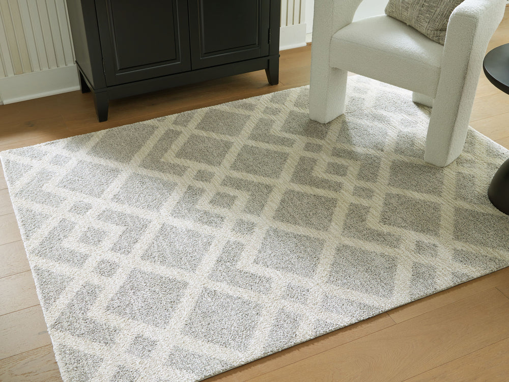 Time for a floor refresh? This trend-right rug is buzzing with interest and newfound energy. Its dynamic geometric design is grounded by subtle shades of gray and ivory that complement so many settings. Weâ€™re talkinâ€™ a treat for your feet and a feast 