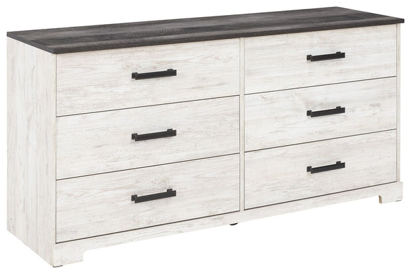 Give provincial a new meaning with the chic look of this dresser. The two-tone finish keeps this piece light and fresh while the warm pewter-tone hardware adds an industrial touch. The distressed whitewashed body adds a delightfully homespun charm to your