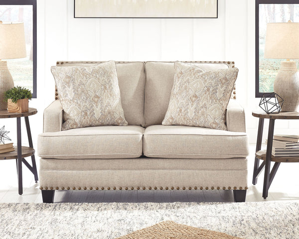  this loveseat in beige brings a fresh perspective to modern farmhouse living. Distinctive elements include t-cushions that wrap around setback track arms