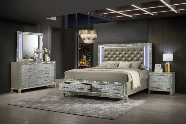 Discover the elegance of the Radiance Queen 4 Piece Bedroom Set in Platinum Silver, featuring a storage bed, 6 drawer dresser, lighted mirror, and 2 drawer nightstand, meticulously crafted for unparalleled stability and durability from a blend of solid ru