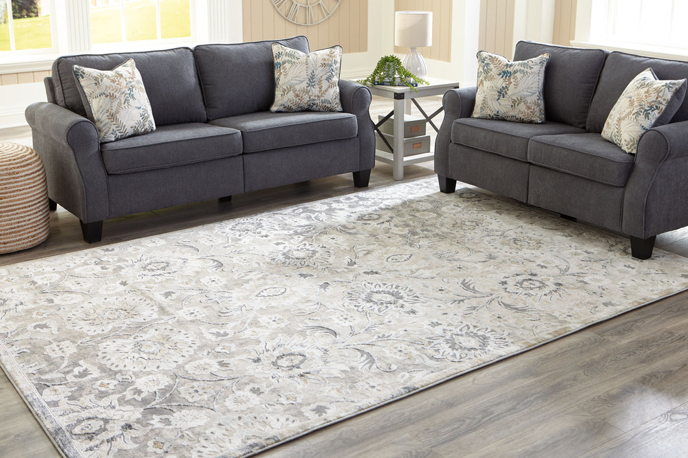 We-'re wild about this botanical-themed rug. With a plush feel and a dynamic, artful design in cream, gold, sage and shades of gray, it adds warmth and interest to your living space. While soft and textural underfoot, this rug is durable enough for any ar