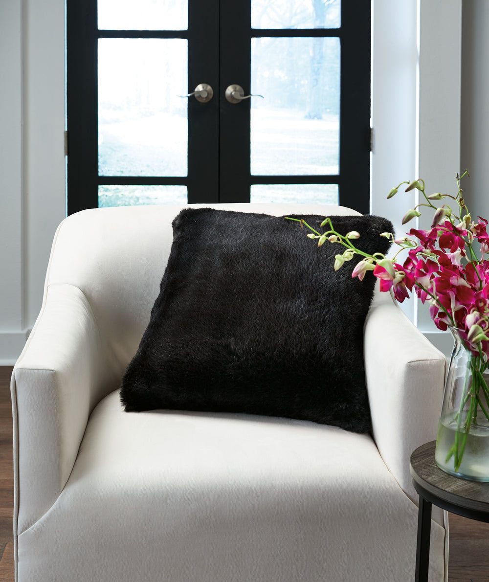 Soft, subtle and sensational. The plush feel of this faux rabbit fur pillow will drive you wild. Its black hue pairs with a variety of decor, from casual to contemporary.<br/><br/><b>Product Features</b><ul><li>Made of polyester</li><li>Soft polyfill</li>