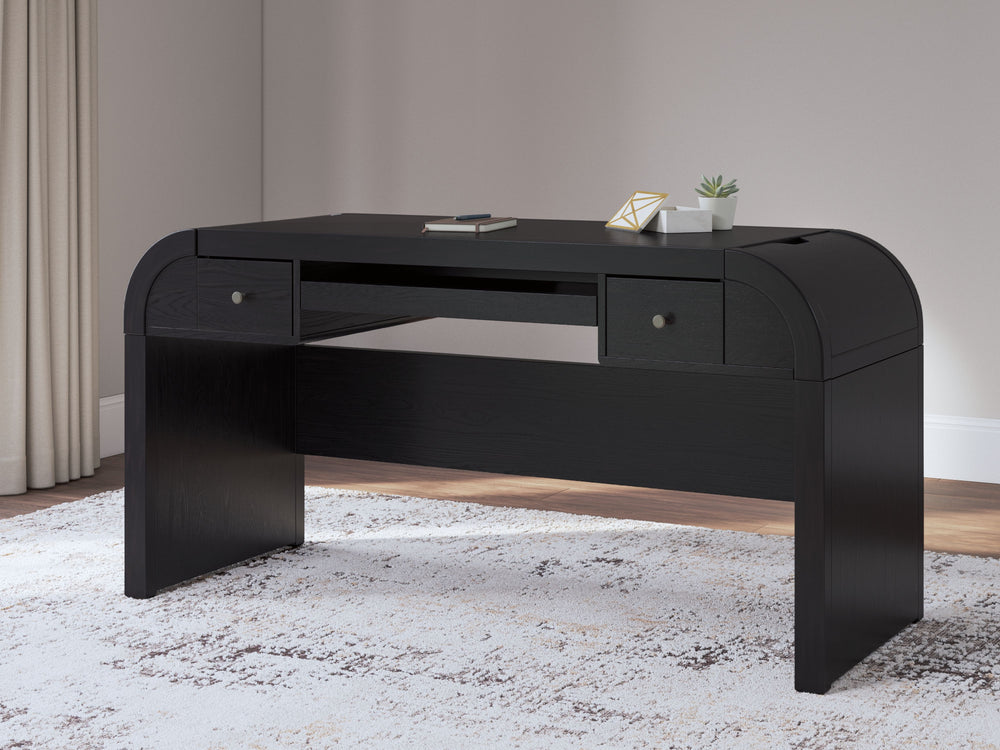 Contemporary lifestyle design. Made with hardwood solids, Ash veneer and MDF substrate. Rich layered black finish on textured wood grain surface. Desk is loaded with features such as 2 small drawers, a pull out keyboard tray, 2 utility bins, a 110V power 