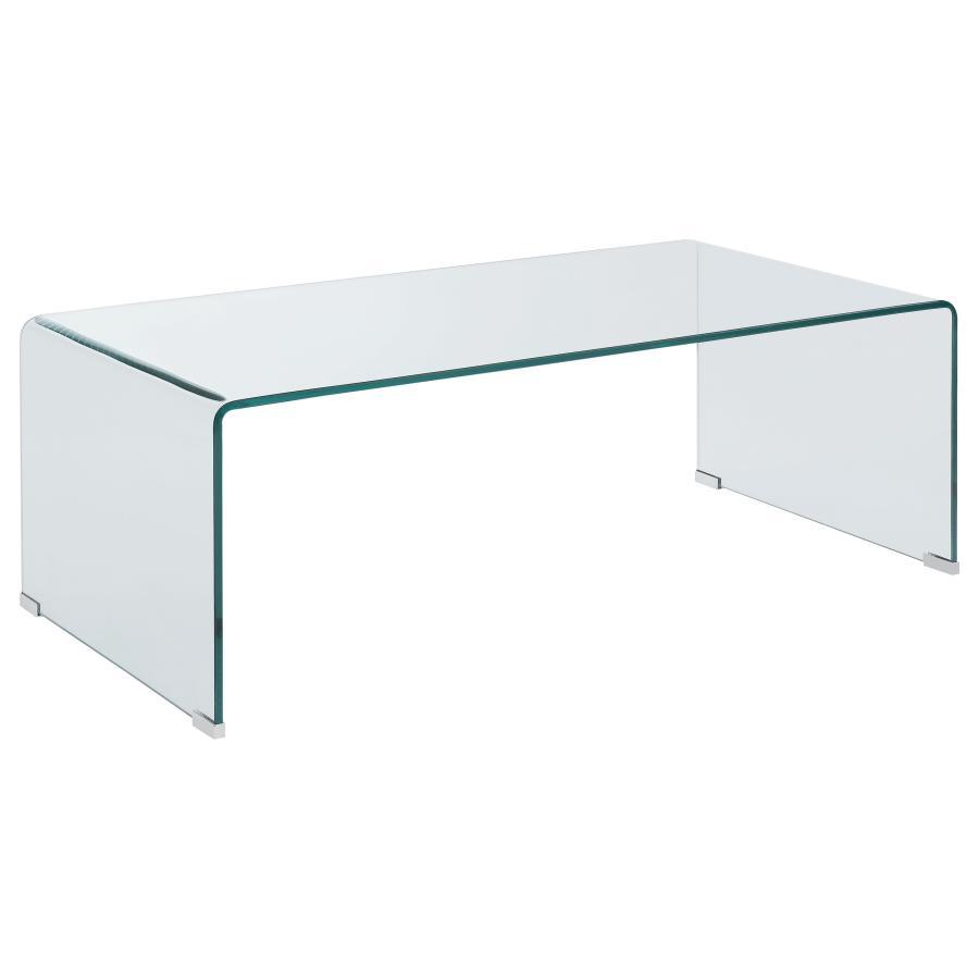 This rectangular coffee table is crafted from tempered bent glass, blending modern elegance with superior durability. Its seamless one-piece design eliminates the need for assembly, offering immediate convenience and use. The smooth curved edges enhance s