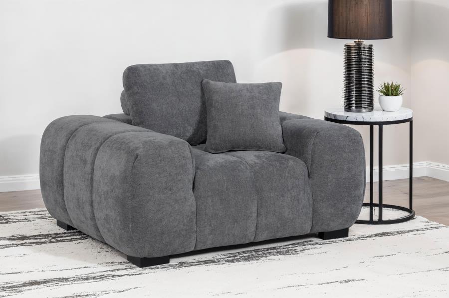 Transform your reading nook or living area into a haven of comfort with this mid-century inspired chair. Its wide, rounded arms and plush, tufted waterfall seat invite you to relax, while soft, neutral upholstery enhances its cozy appeal. A durable frame 