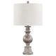 Dress up end tables and consoles with this elegant, contemporary table lamp. Designed with a contoured poly frame with intricate details, this sophisticated table lamp lends itself to transitional interiors easily. Enhanced by the weathered appearance of 